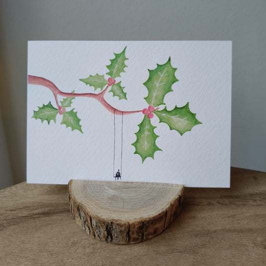 Schommelen onder een kersttak